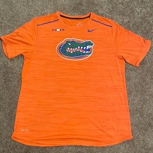 Nike dri-fit workout T-shirt. Never worn. Colors orange and blue.